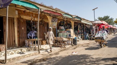 Massacre at Nigerian market leaves more than 30 dead as gunmen torch stalls, kidnap others