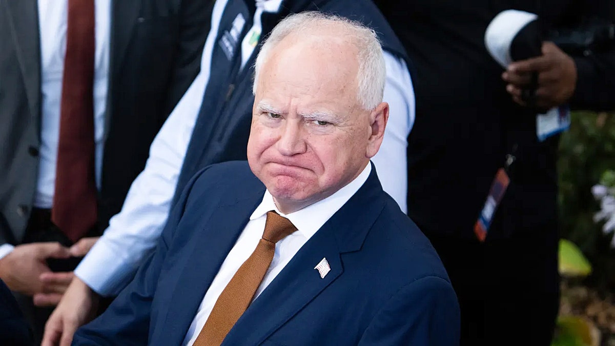 Minnesota Gov. Tim Walz smirking. 