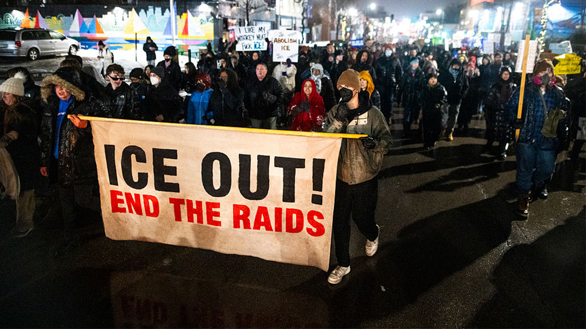 People march during a protest after the killing of Renee Nicole Good