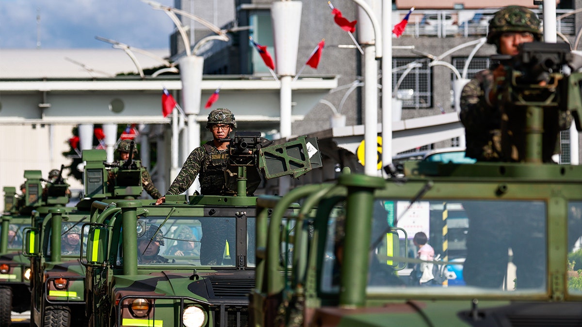 A procession of Taiwanese armed military vehicles patrols outside the Songshan Airport in the capital city following China's announcement of the military exercise Joint Sword-2024B that encircles Taiwan on October 14, 2024 in Taipei, Taiwan.
