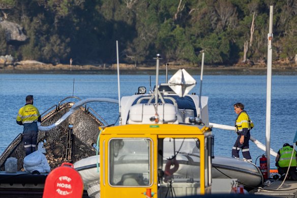 Port Authority workers examining the scene.