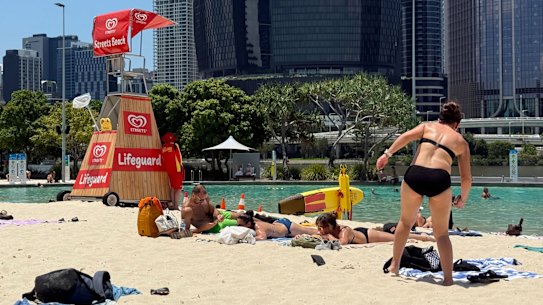 South-east Queensland is set to swelter through a severe heatwave and more storms this week. Pic description: swimmers cool off at Streets Beach in South Bank. 