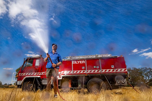 Michael Blackburn with one of his ex-CFA tankers. Private units were essential in stopping recent Victorian fires. 