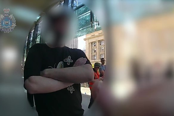 The man being spoken to by police.