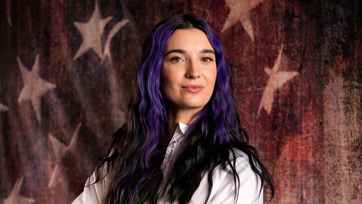 Brenna Huckaby looks on