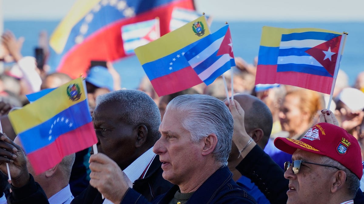 Cuban President Miguel Diaz-Canel greets supporters in Cuba.