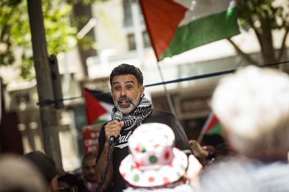 Nasser Mashni speaks at a rally in Melbourne.