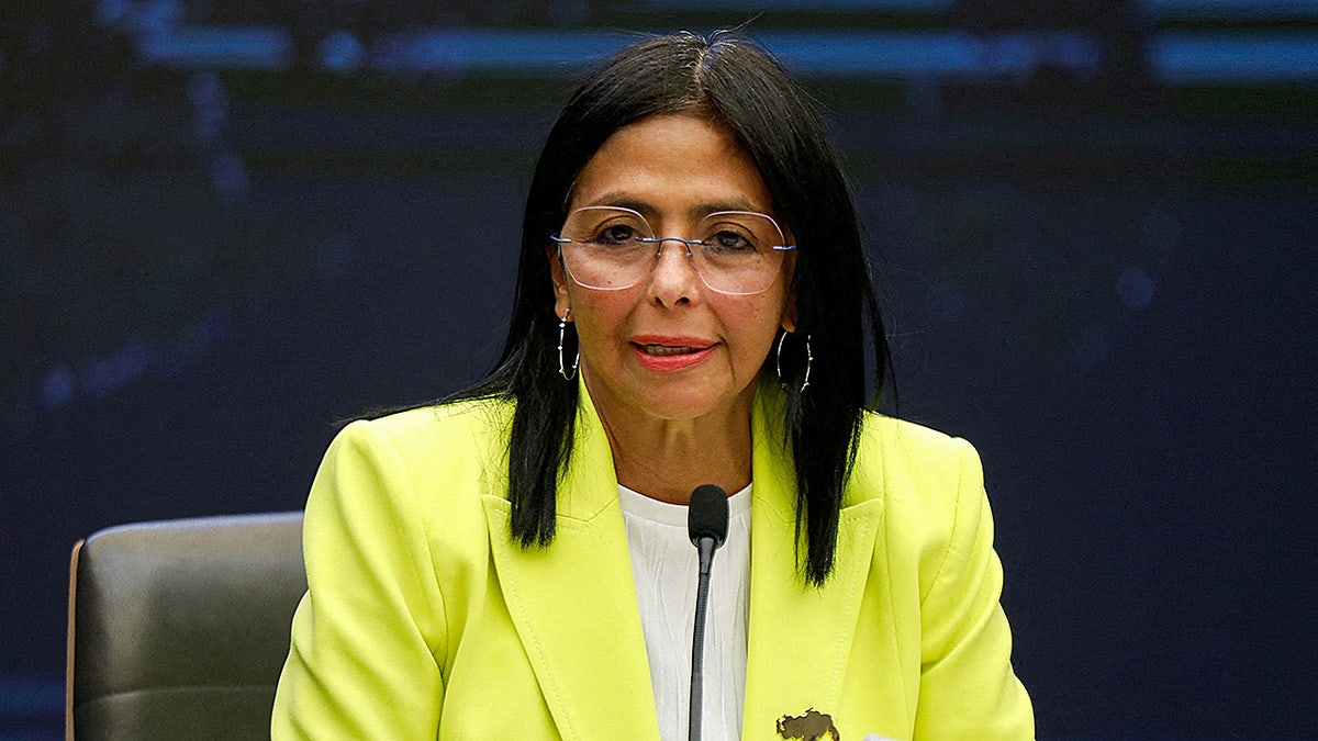 Delcy Rodriguez speaks at microphone