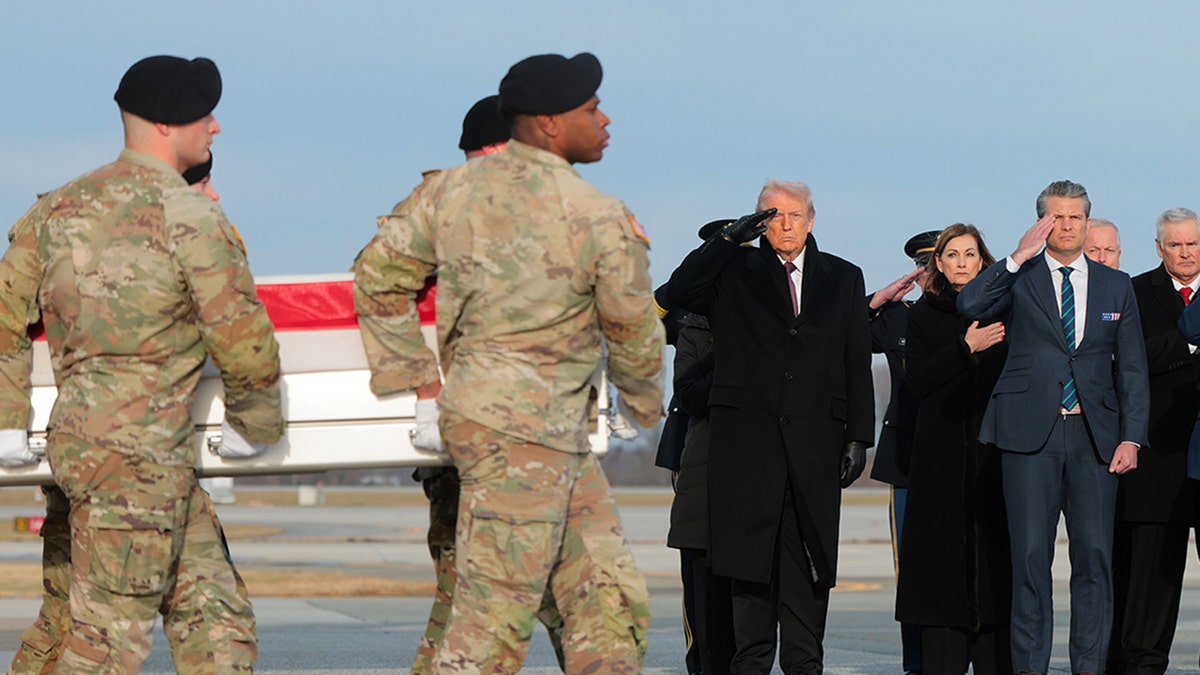 Dignified transfer with Donald Trump saluting.