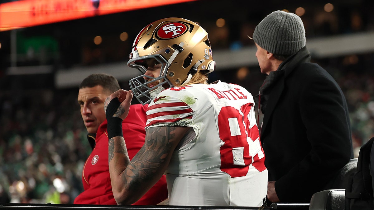 George Kittle carted off field