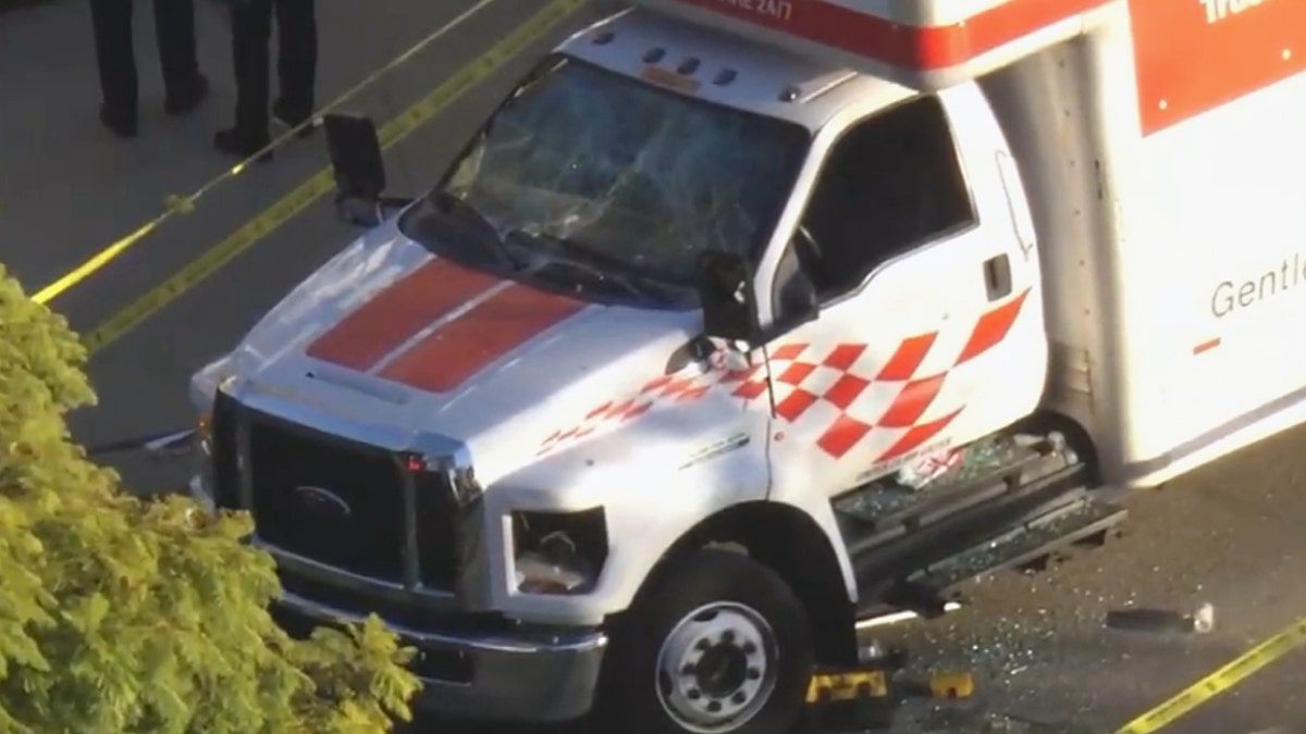 U-Haul truck with front-end damage.