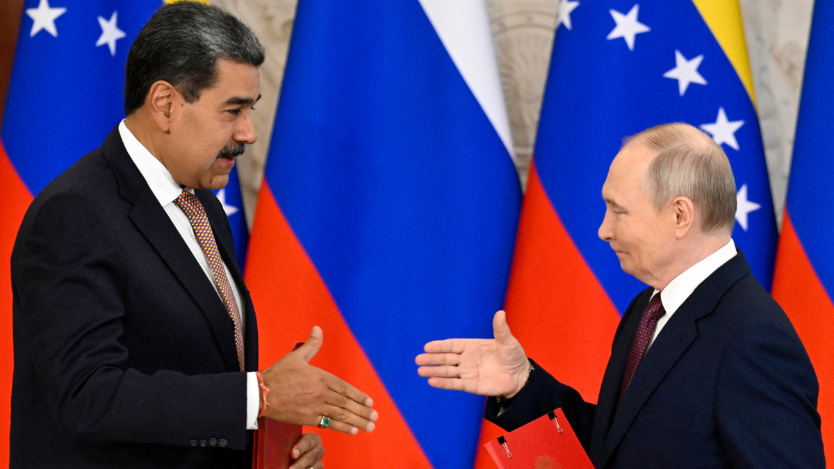 Russian President Vladimir Putin and Venezuelan President Nicolas Maduro shake hands following a meeting at the Kremlin.