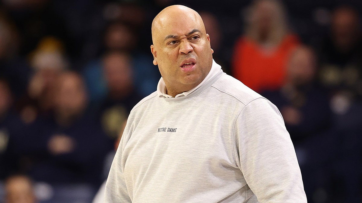 Micah Shrewsberry looks on court