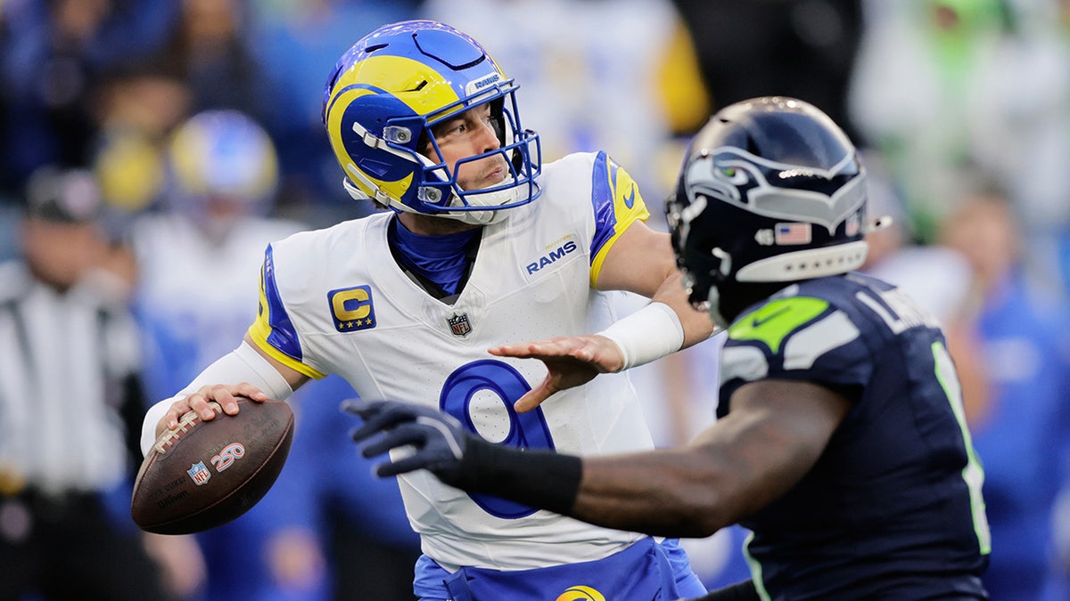Matthew Stafford looks to throw down field