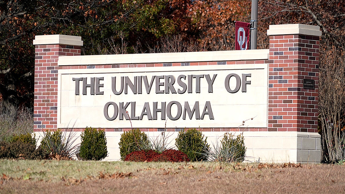 A campus sign for the University of Oklahoma is seen on a grassy area in Norman, Oklahoma.