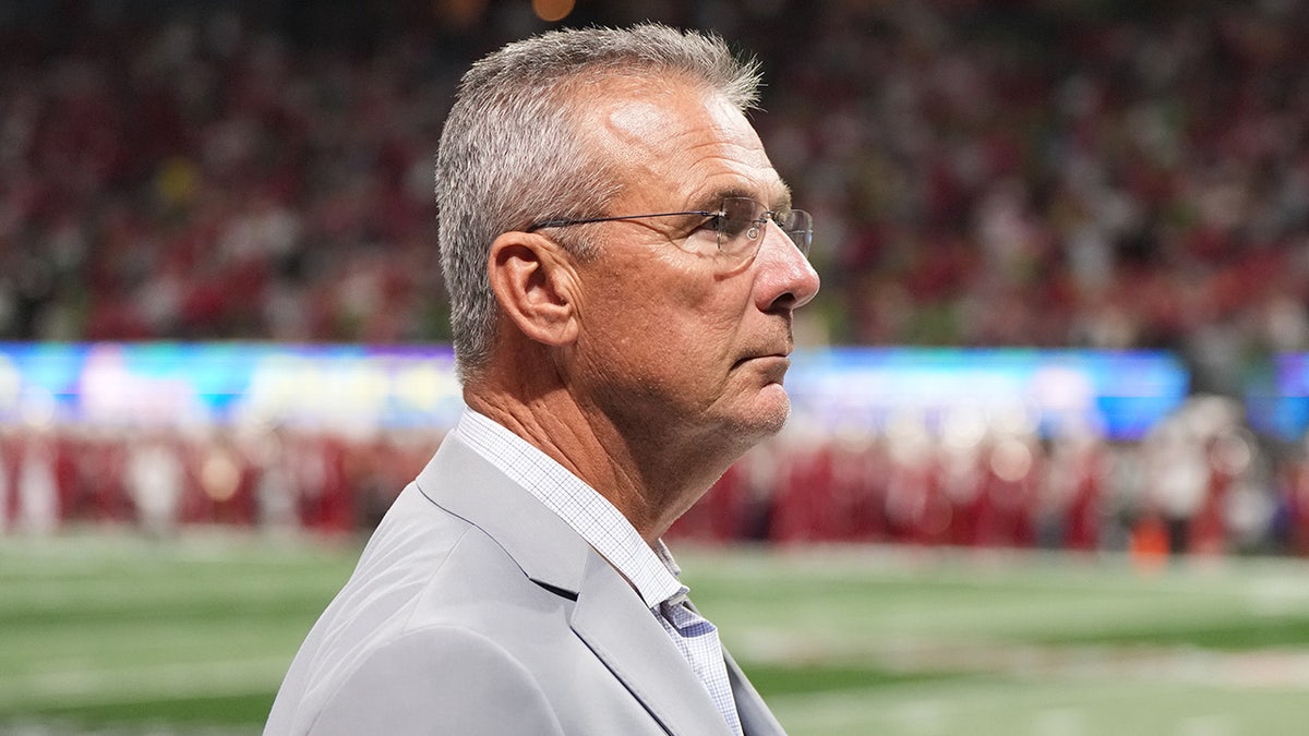 Urban Meyer looks on during a game
