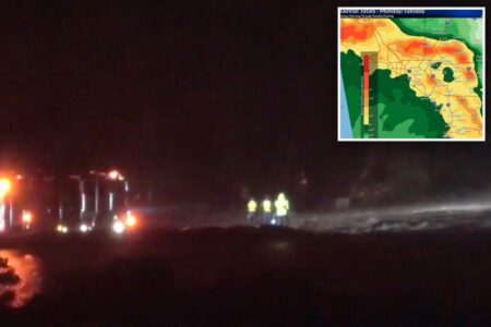 Frantic search for driver swept away by raging SoCal floodwaters after clinging to truck’s roof