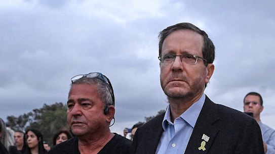 Israeli President Isaac Herzog (2nd from right) among families of those killed at the site of the Nova music festival on the first anniversary of the October 7 Hamas attack in 2024.