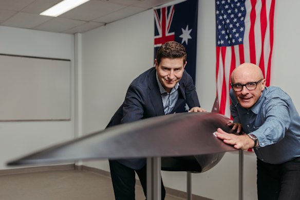 Hypersonix co-founder Michael Smart (right), with CEO Matt Hill and a model of the Dart AE scramjet. 
