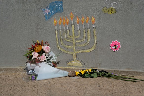Flower tributes at the footbridge where the Bondi shootings took place.