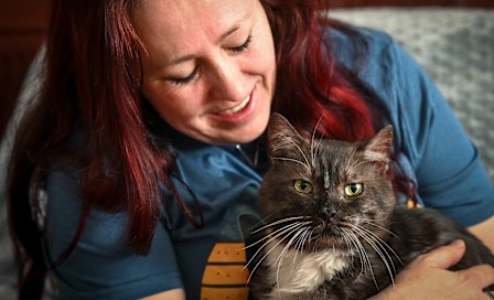 In from the cold: cat rescuer Claire Brookes with former ‘gangster’ cat Fat Tony.