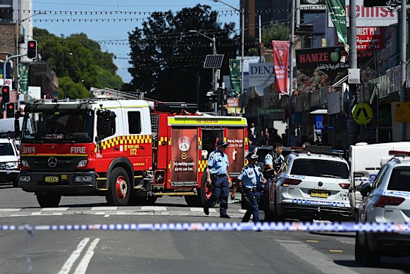 Emergency services at Merrylands, where one person was killed and two injured in a stabbing attack.