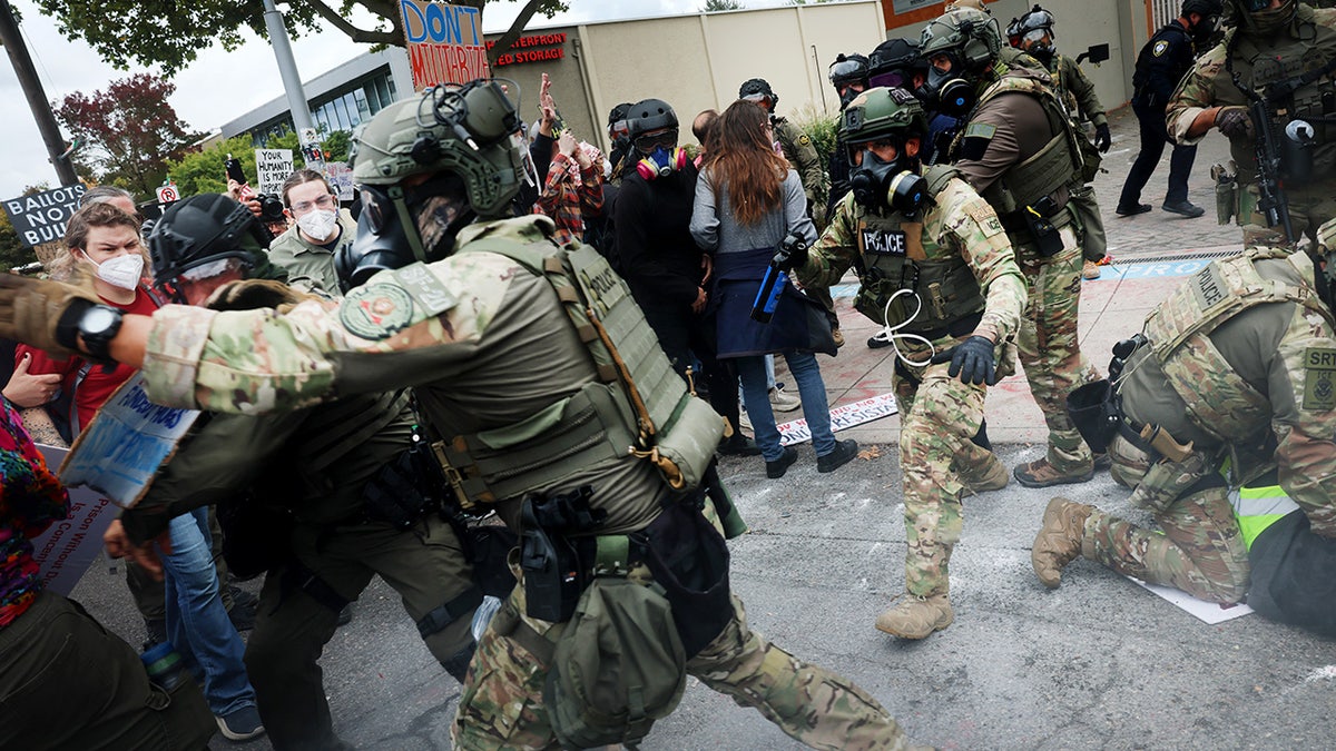 Federal agents confront protesters outside ICE facility in Oregon.
