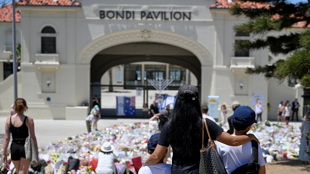 People gather at a memorial for the Bondi Beach attack victims