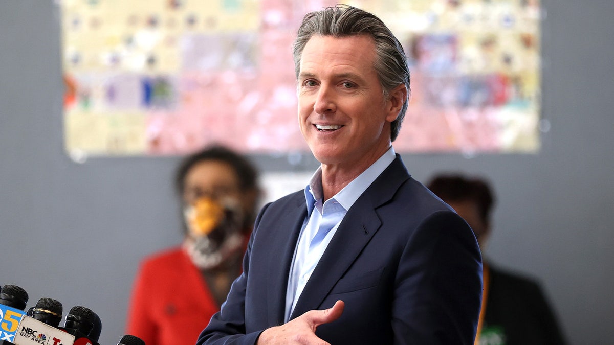 Newsom speaking at a school