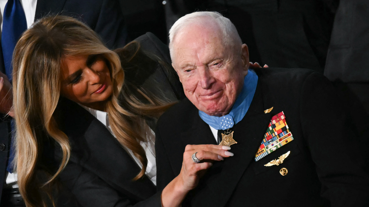 U.S. First Lady Melania Trump presents US veteran Captain E. Royce Williams with the Medal of Honor during the State of the Union address.