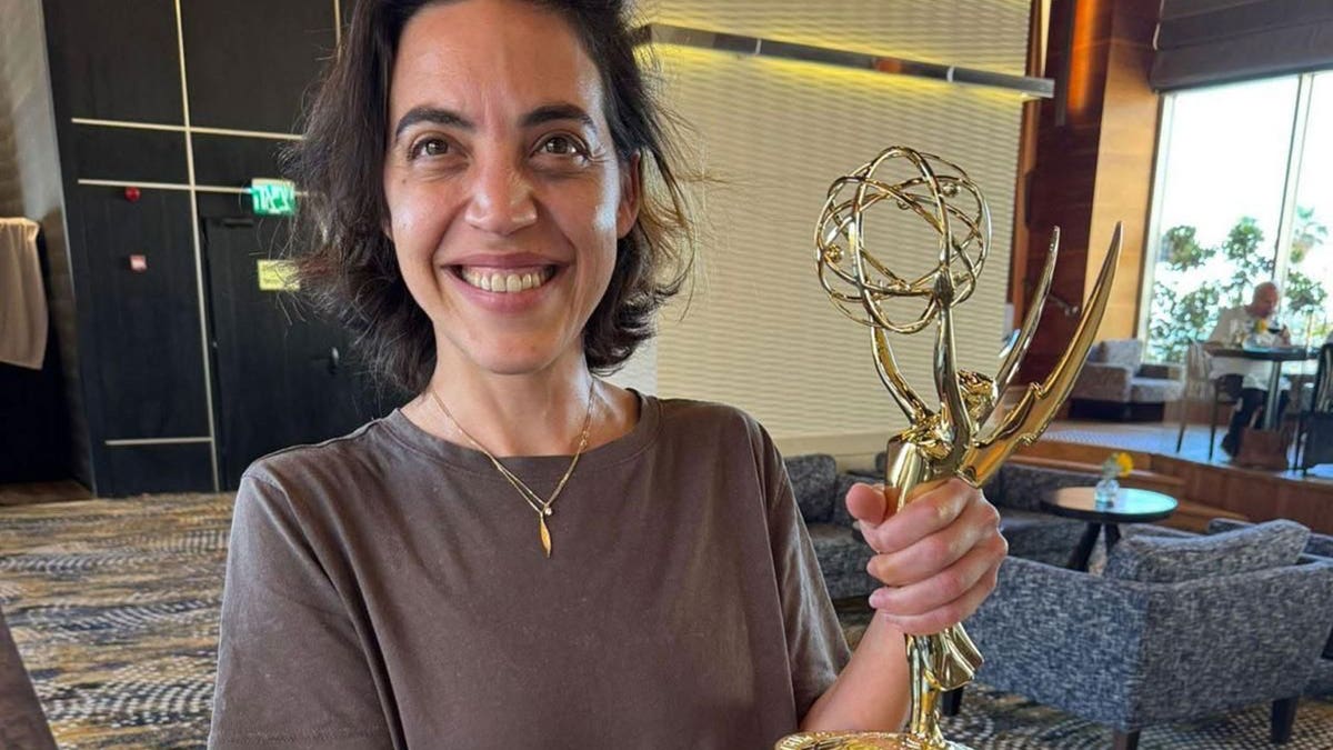 Michal Weits with Emmy Award for the documentary