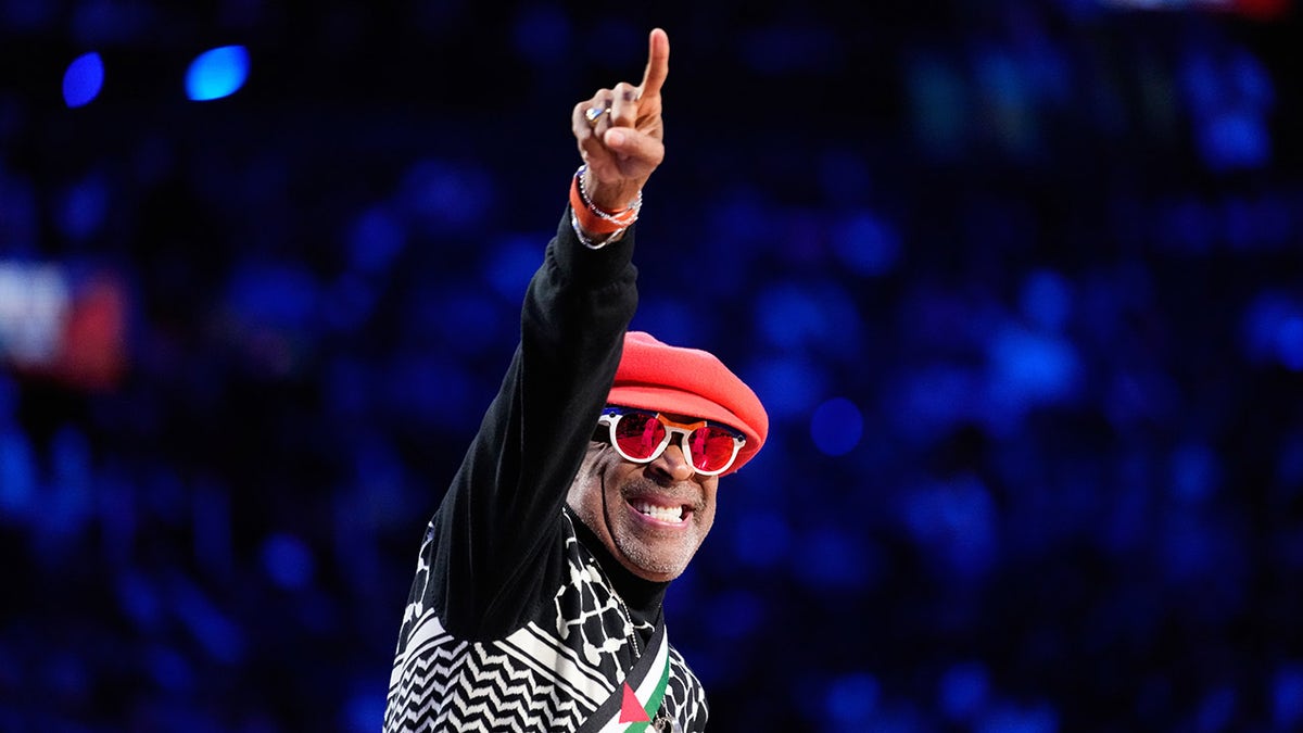 Spike Lee points down the court