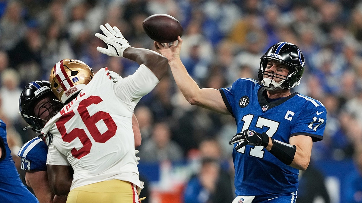 Philip Rivers passes the football