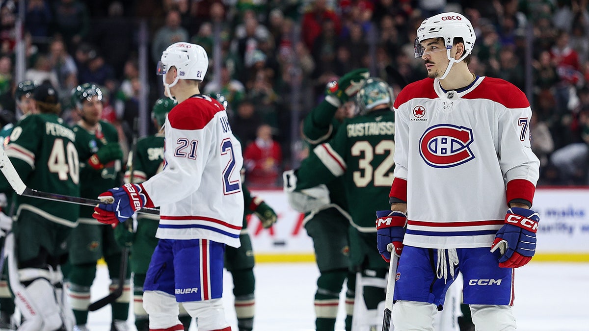 Somber Canadiens players after an overtime loss