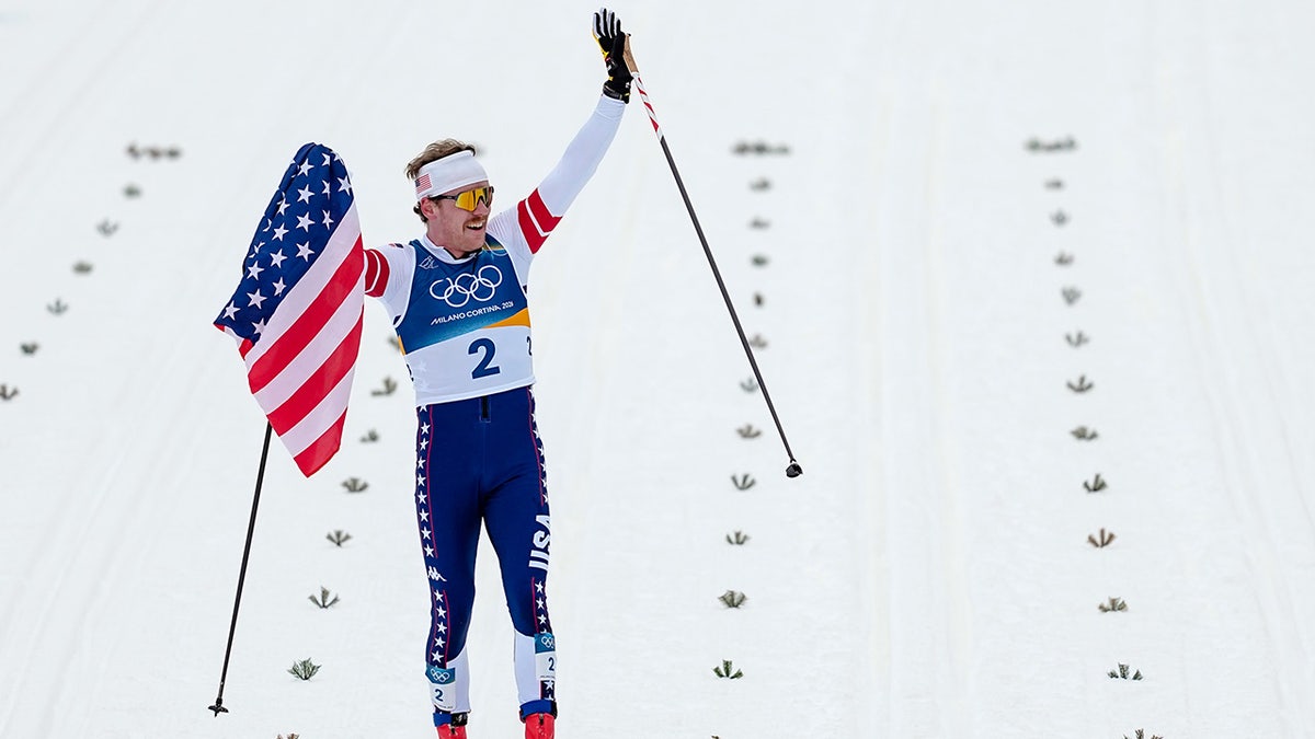 Ben Ogden holds the American flag