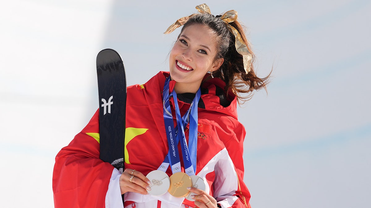 Eileen Gu smiles with her medals