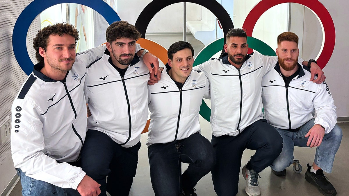 Israel bobsledders pose for a photo