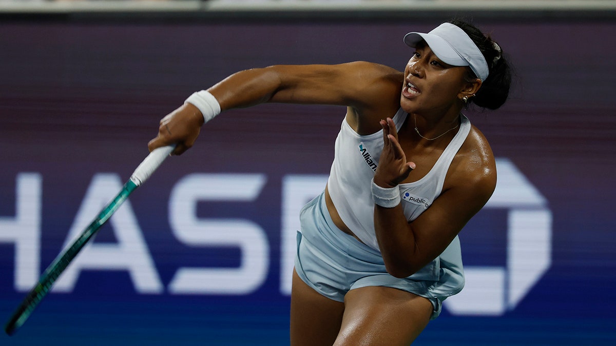 Destanee Aiava serves the ball