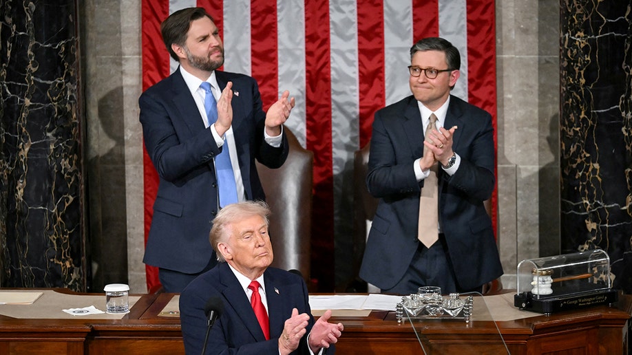 US President Donald Trump applauds as US veteran Captain E. Royce Williams receives the Medal of Honor
