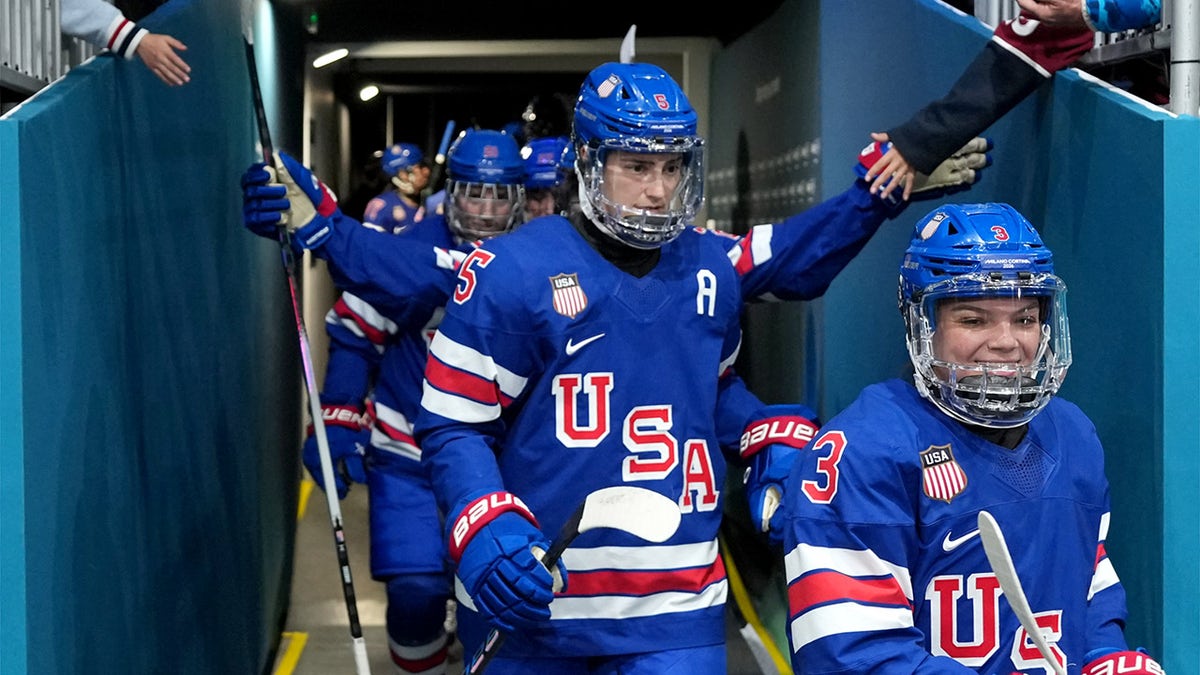 Players enter the ice