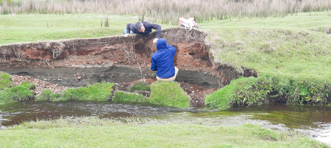 Researchers work at a creekbed nearr Monte Verde