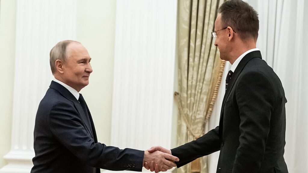 Russian President Vladimir Putin handed two Hungarian prisoners of war