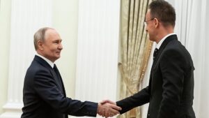 Russian President Vladimir Putin handed two Hungarian prisoners of war