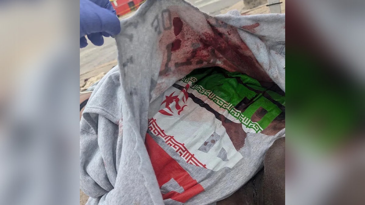 Austin bar shooter's shirt with Iran flag