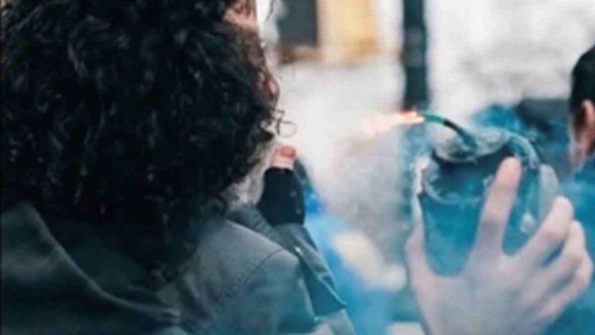 Suspect holding bomb.