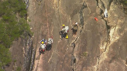 Search and rescue crews retrieved a pair of 18-year-old hikers who fell down a cliff face on Mount Beerwah on Sunday.