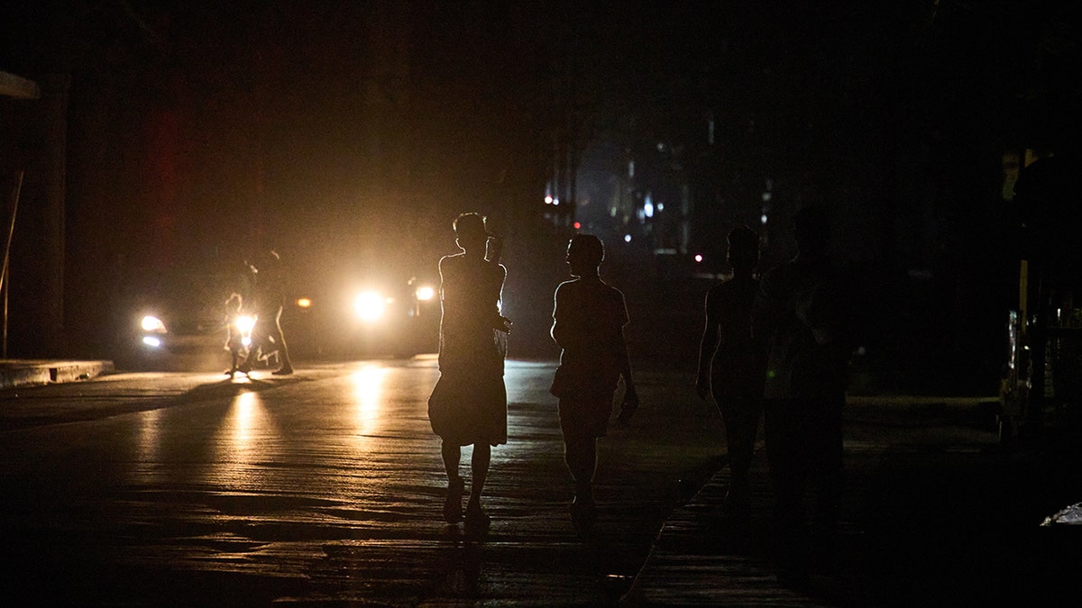 People walk in Havana, Cuba, during blackout