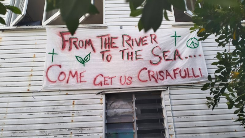 Police raid house showing ‘from the river to the sea’ banner outside