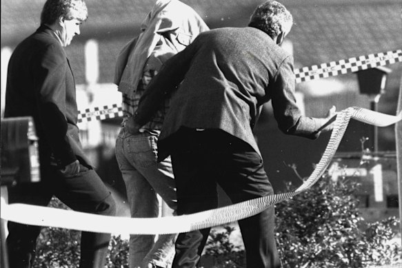Ivan Milat is arrested after a dawn raid of his Eagle Vale home in 1994.