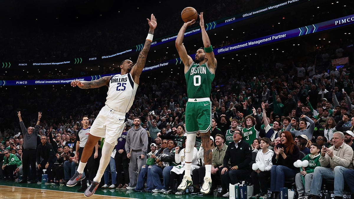 Jayson Tatum shoots the basketball during a game